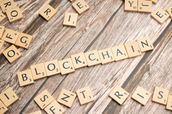 Blockchain word spelled with wooden tiles