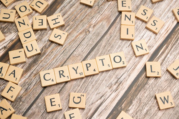 Crypto word spelled with wooden tiles