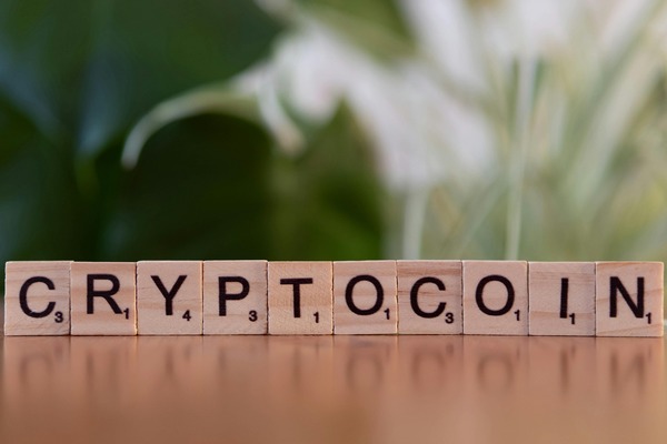 Cryptocoin spelled with wooden tiles
