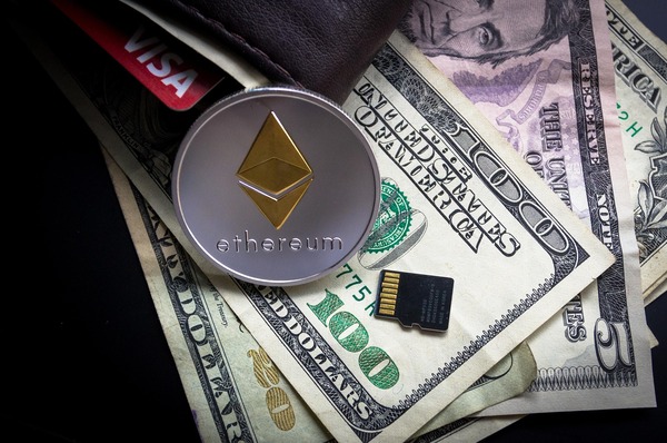 Ethereum coin on banknotes with a memory card