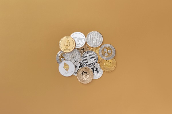 Group of crypto coins on a brown background