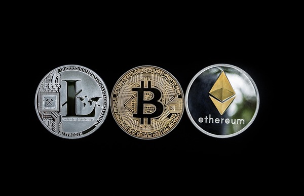 Litecoin, Bitcoin and Ethereum coins in a row