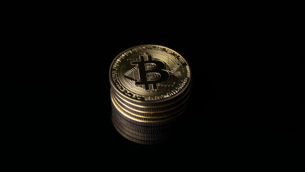 Stack of Bitcoin coins in darkness